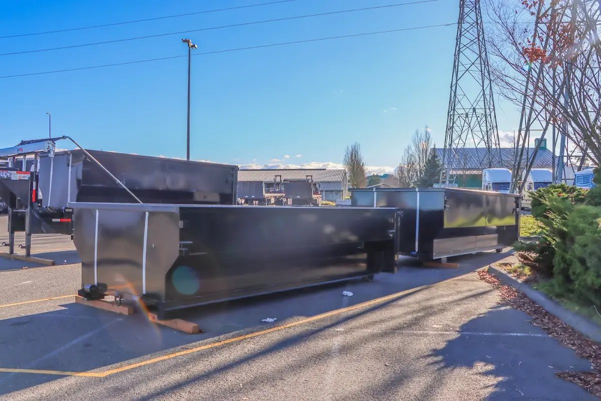 Roll-off dumpster ready for waste disposal at job site for Yard Waste Dumpster Rental in Amelia